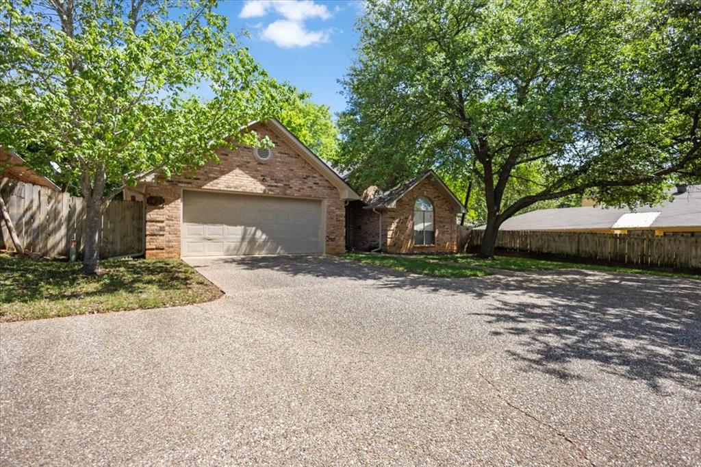 2824 Crestview Avenue Tyler, TX 75701 - Photo 3 of 39 a front view of a house with a yard and garage