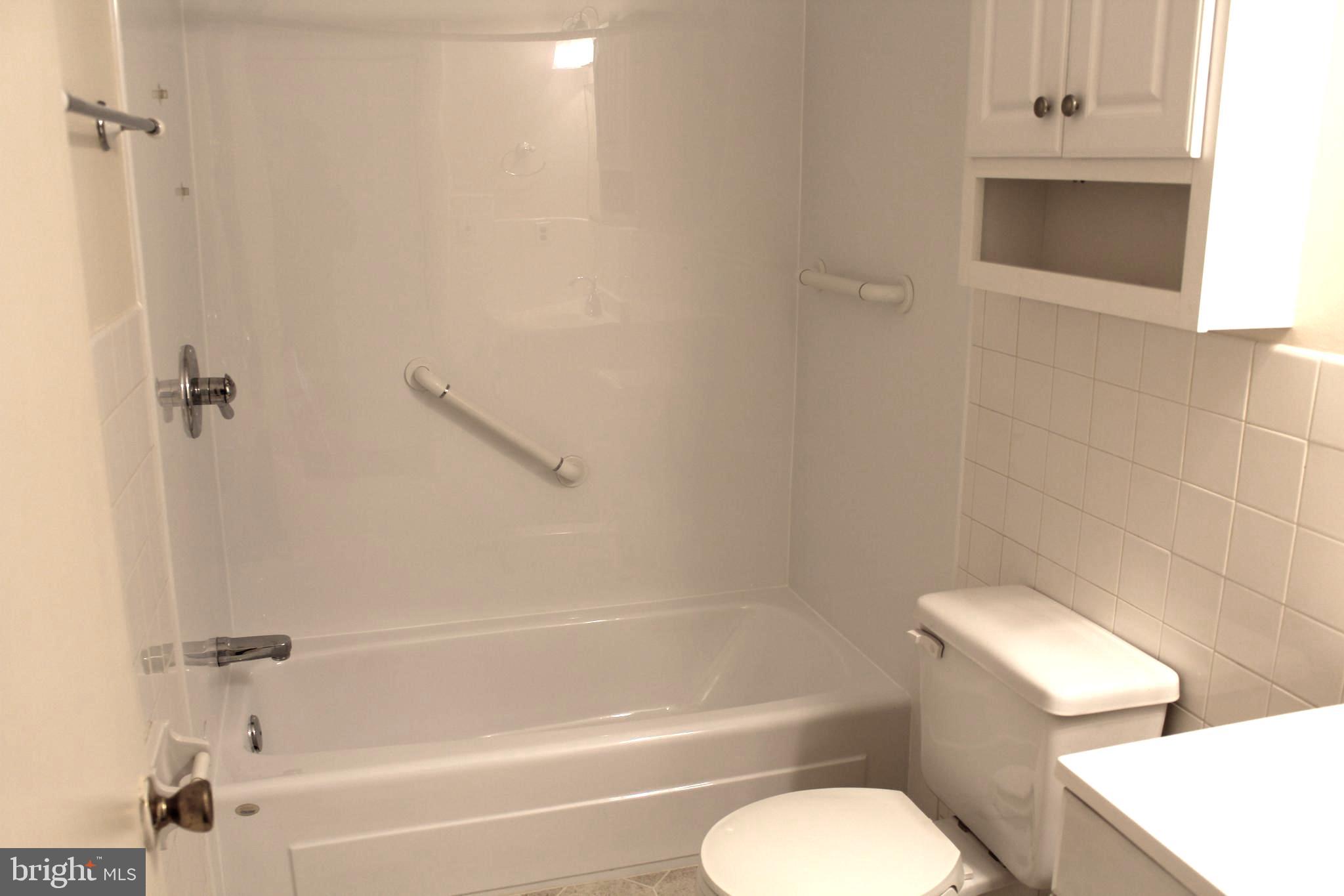 214 Lexington Road Schwenksville, PA 19473 - Photo 25 of 29 a bathroom with a toilet and a bathtub