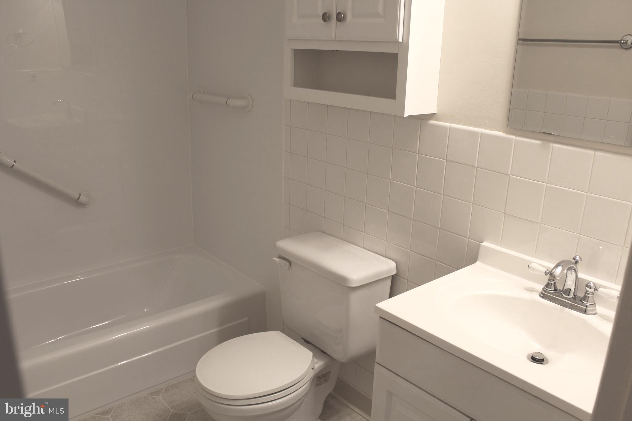 214 Lexington Road Schwenksville, PA 19473 - Photo 26 of 29 a white toilet sitting next to a bath tub