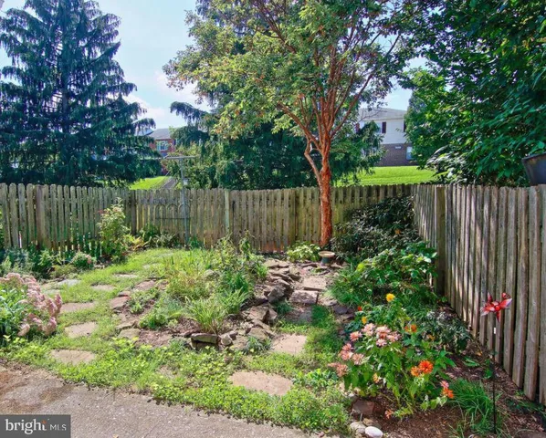 a garden with wooden fence
