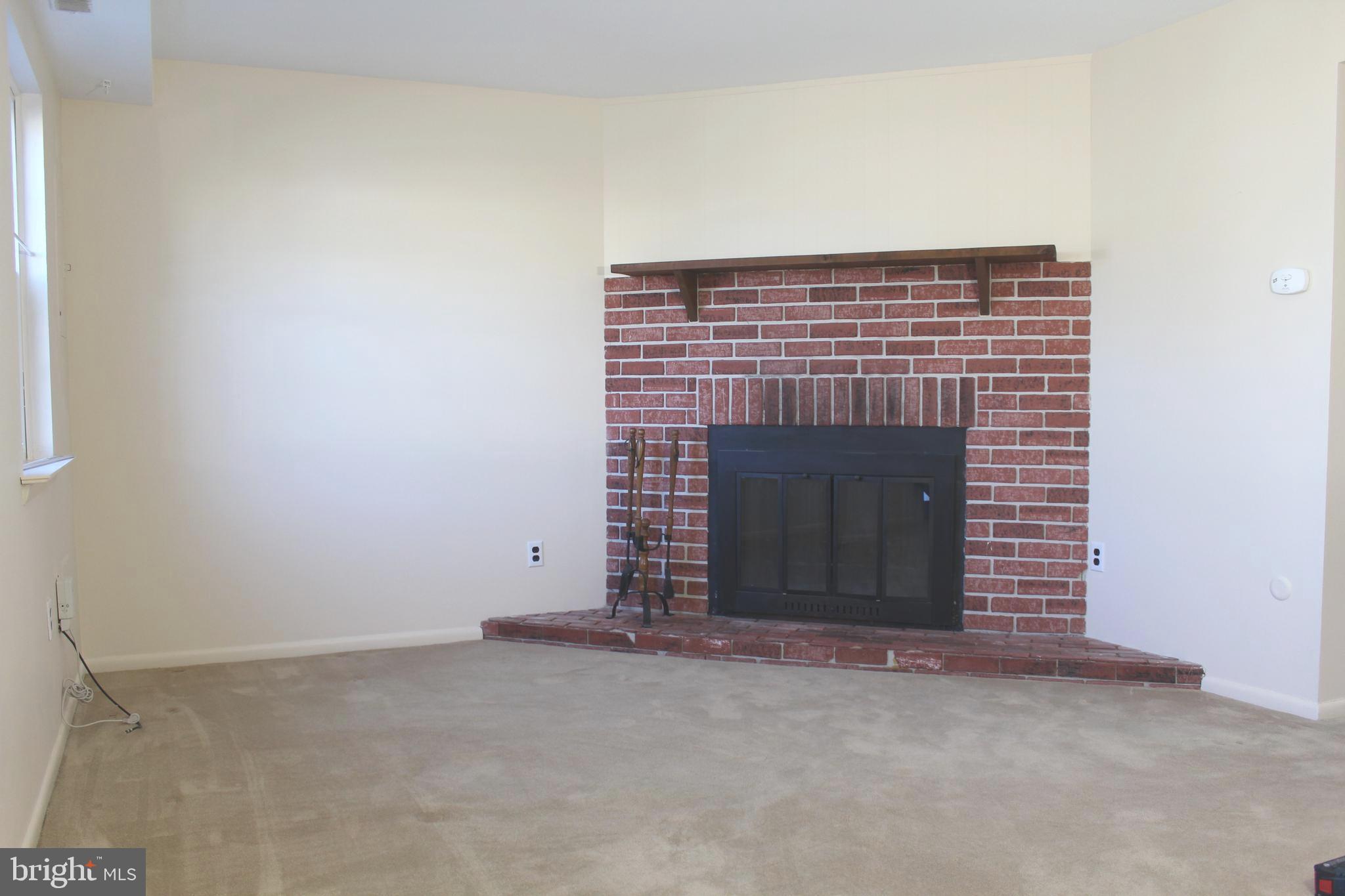 214 Lexington Road Schwenksville, PA 19473 - Photo 6 of 29 a view of an empty room and fire place