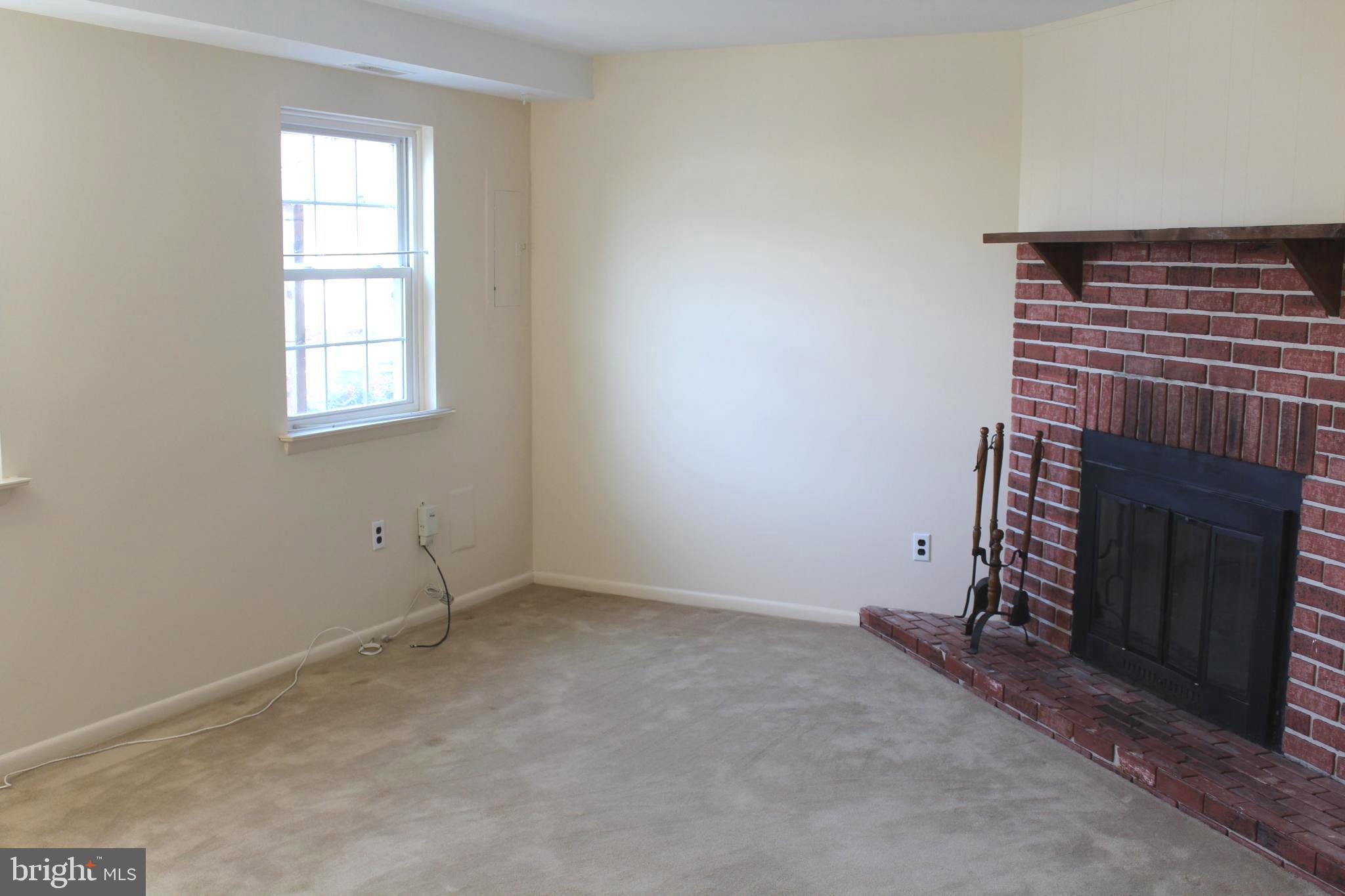 214 Lexington Road Schwenksville, PA 19473 - Photo 8 of 29 a view of an empty room with a fireplace