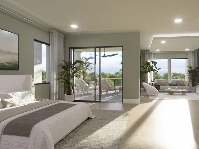 a bedroom with furniture and a large window