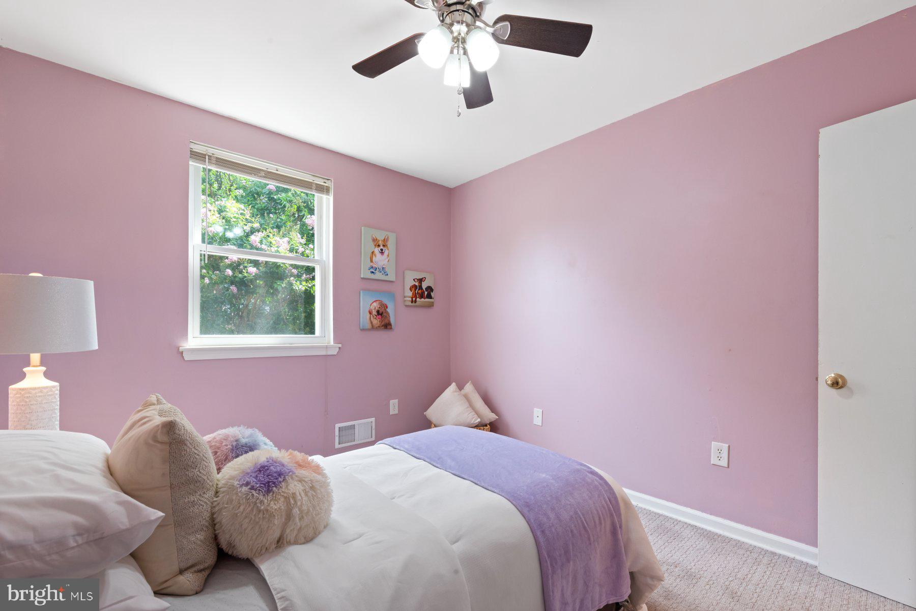 1719 Addison Road South District Heights, MD 20747 - Photo 13 of 22 a bedroom with a bed and a window