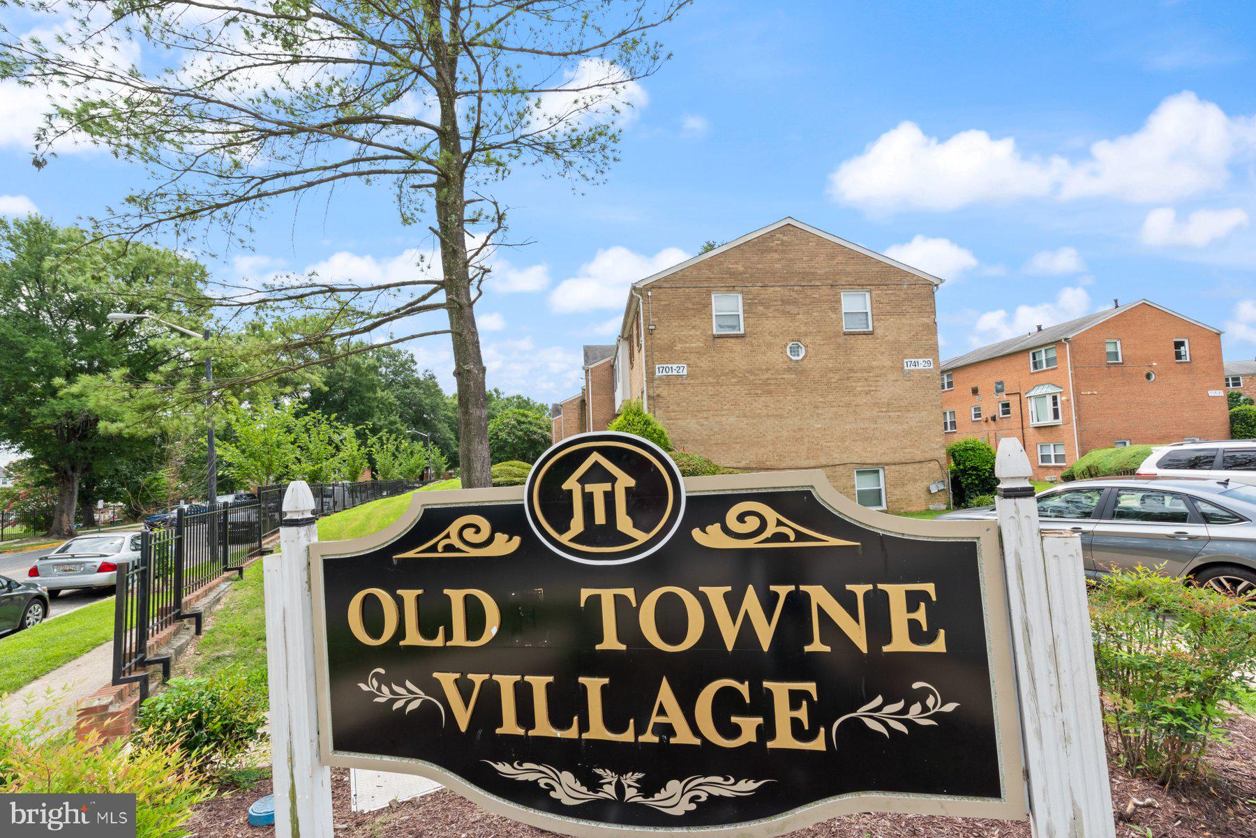 1719 Addison Road South District Heights, MD 20747 - Photo 19 of 22 a front view of a residential building with sign board