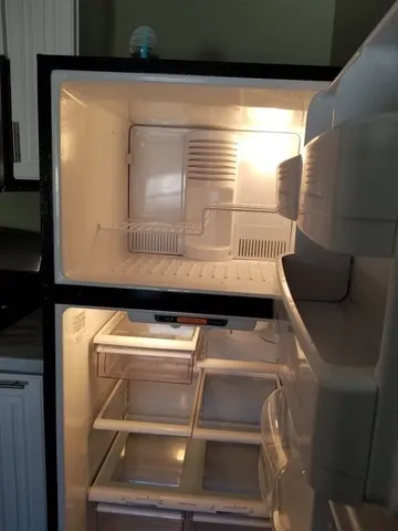 a view of washer and dryer with wooden floor