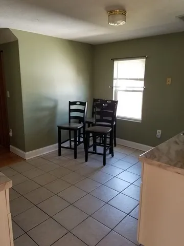 a view of a workspace with furniture