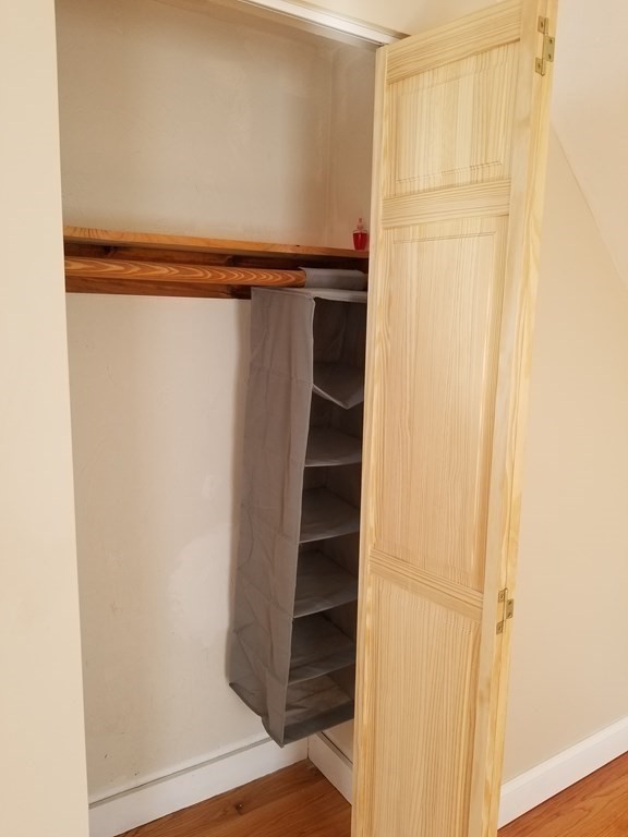 593 Park Street, Unit 3 Boston, MA 02124 - Photo 20 of 29 a view of walk in closet with empty racks