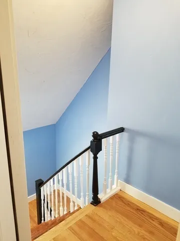 a view of a hallway view with staircase