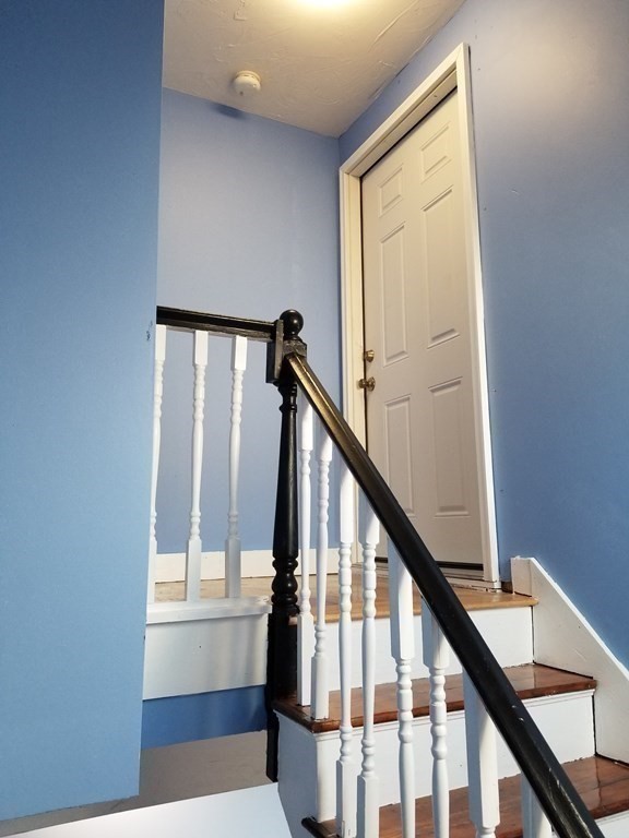 593 Park Street, Unit 3 Boston, MA 02124 - Photo 4 of 29 a view of an entryway with staircase