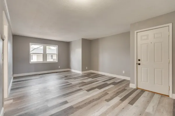 a view of an empty room and window