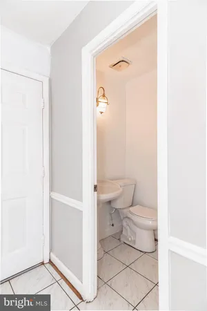 a bathroom with a toilet a sink and shower