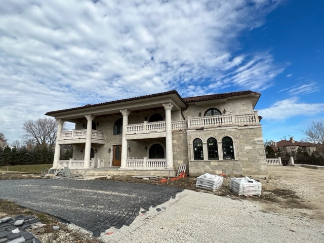 6379 South County Line Road Burr Ridge, IL 60527 - Photo 5 of 8 a front view of a house with a yard