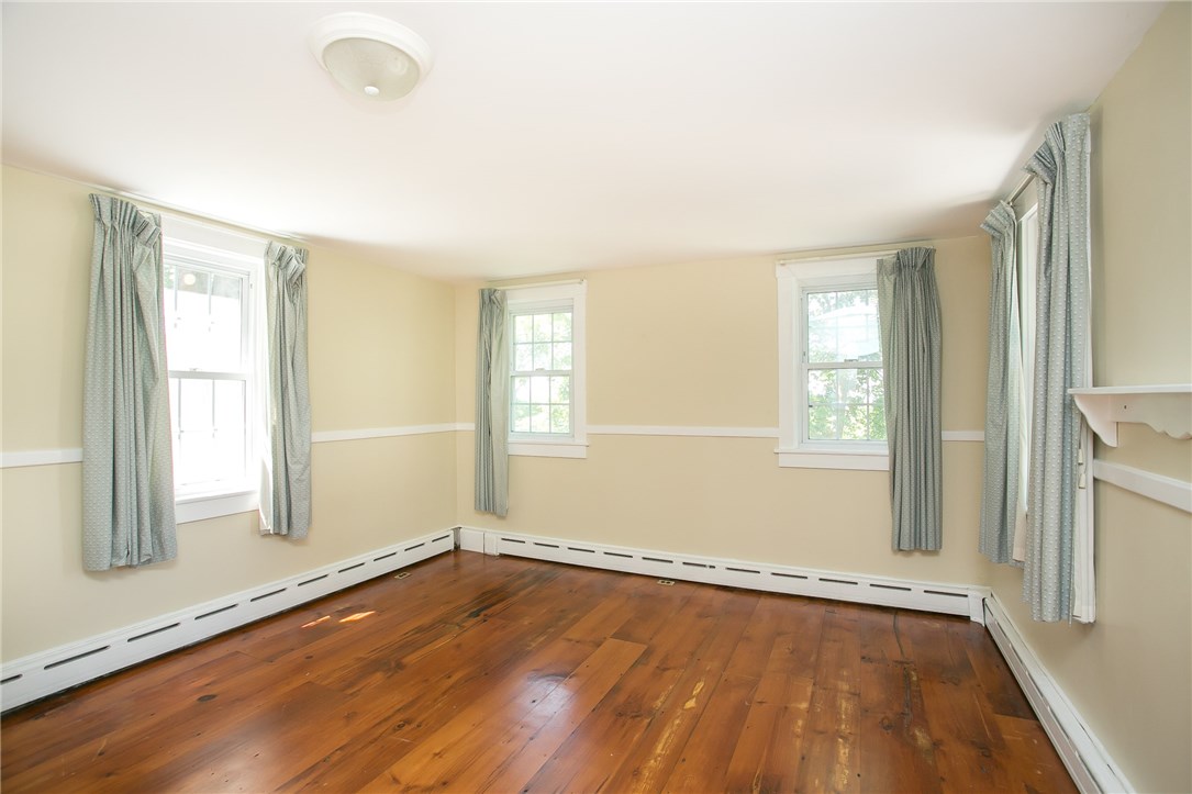 697 Middle Road Portsmouth, RI 02871 - Photo 24 of 38 Many windows in Bedroom 2, north, west and southern exposure