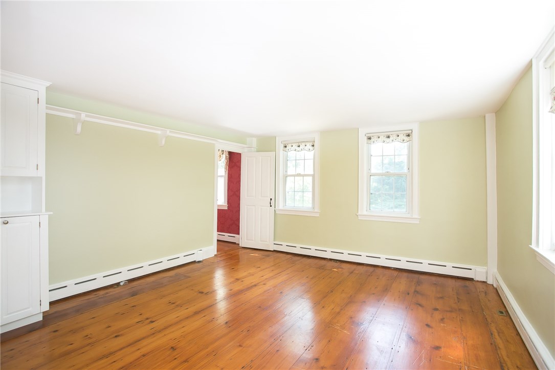 697 Middle Road Portsmouth, RI 02871 - Photo 26 of 38 Bedroom 3 faces east and also opens to the front hallway and 2nd floor family room.
All the rooms are designed around the center chimney and have approximately the same dimensions.