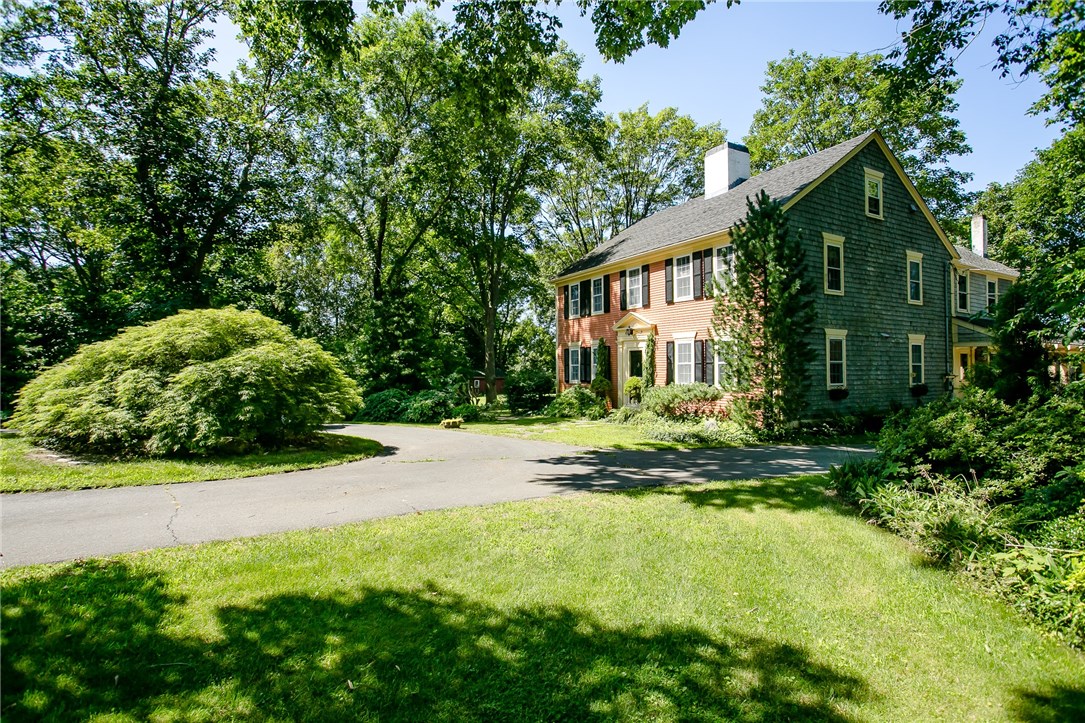 The circular driveway portrays a grand entrance to the property.