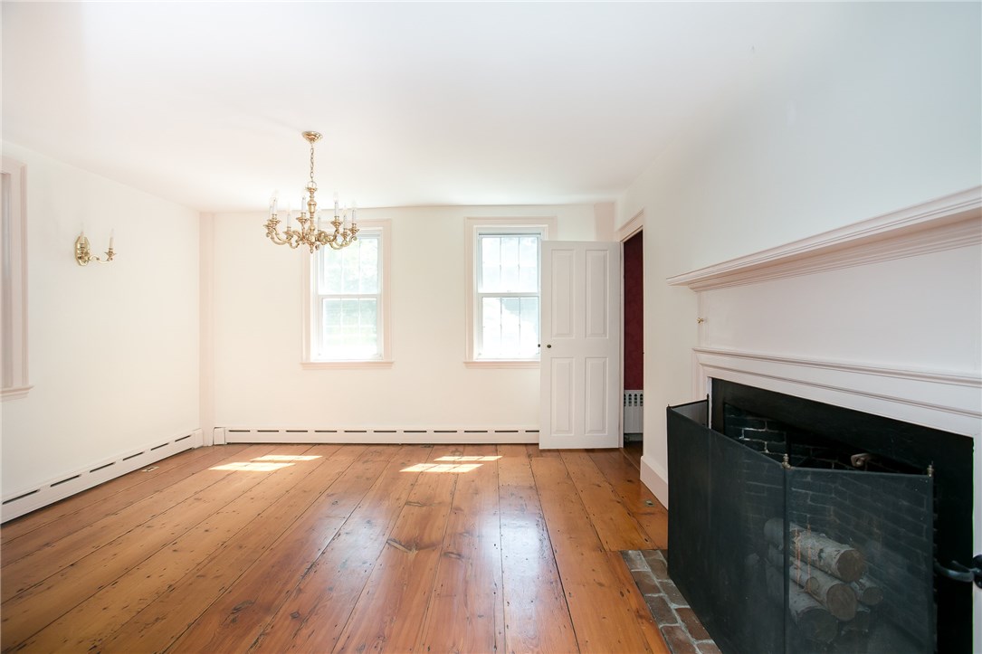 697 Middle Road Portsmouth, RI 02871 - Photo 9 of 38 Formal dining room opens to the front hallway and to the kitchen.