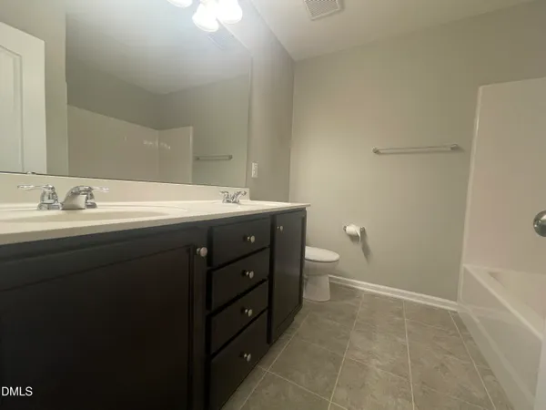 a room with a sink and a toilet