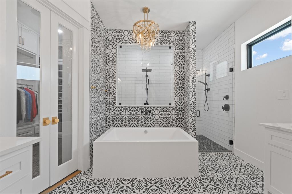 613 Wildcat Way Kennedale, TX 76060 - Photo 19 of 40 a bathroom with a bathtub a sink and a shower