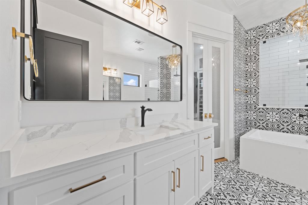 613 Wildcat Way Kennedale, TX 76060 - Photo 20 of 40 a bathroom with a sink a toilet and shower