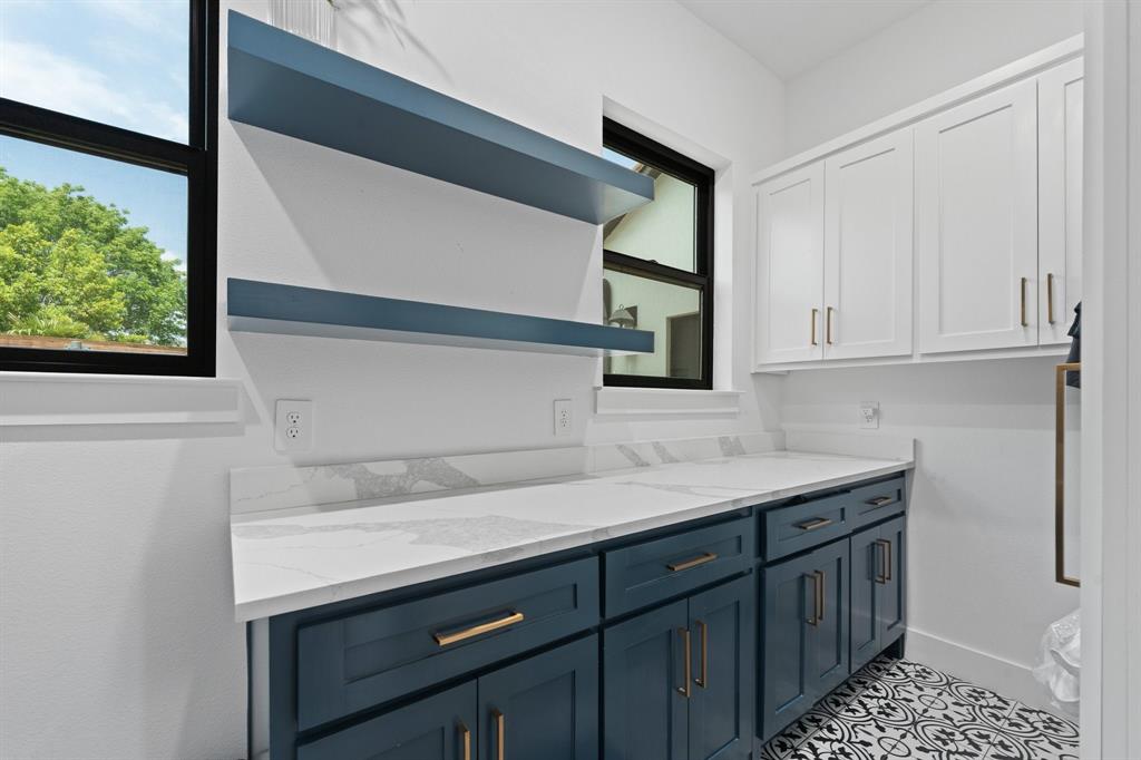 613 Wildcat Way Kennedale, TX 76060 - Photo 22 of 40 a kitchen with a sink and cabinets