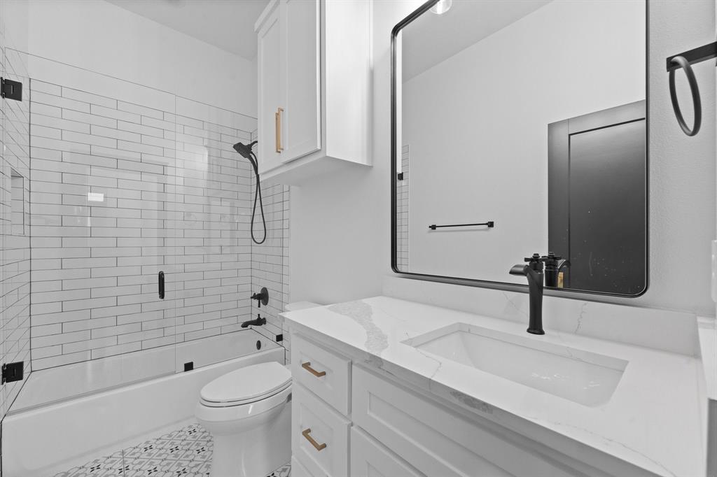613 Wildcat Way Kennedale, TX 76060 - Photo 29 of 40 a bathroom with a sink a toilet and shower