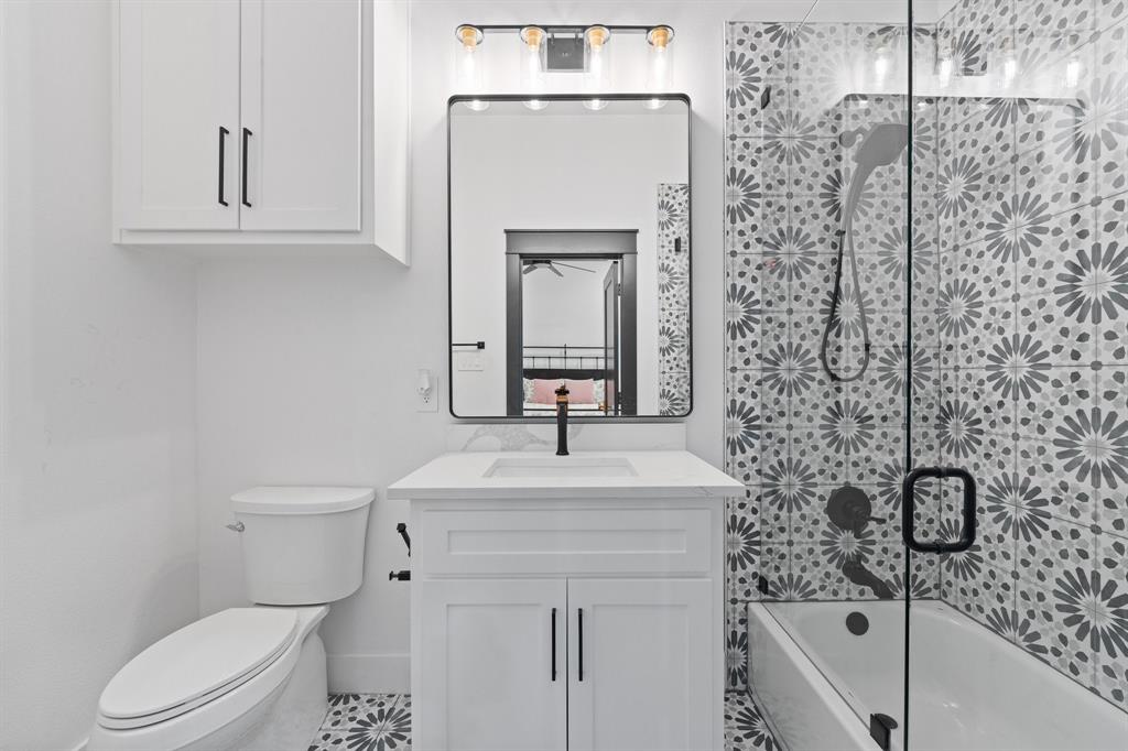 613 Wildcat Way Kennedale, TX 76060 - Photo 31 of 40 a bathroom with a sink a toilet and shower