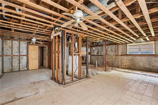 a view of a hall with wooden floor