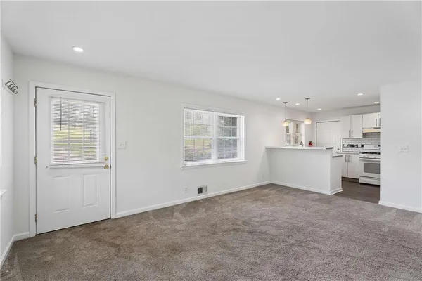 a view of an empty room with a window