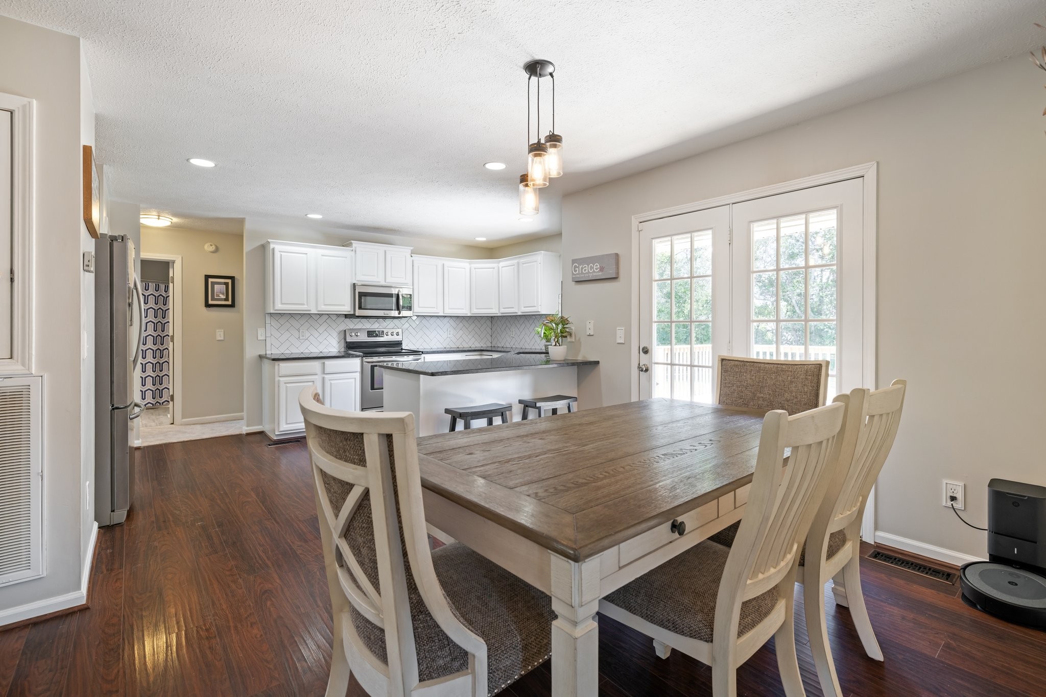 632 Audrey Road Mount Juliet, TN 37122 - Photo 10 of 42 a kitchen with kitchen island a table and chairs in it
