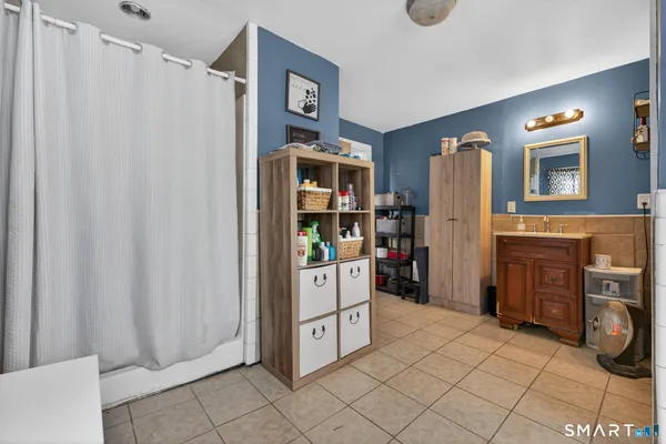a bathroom with a bathtub and a shower