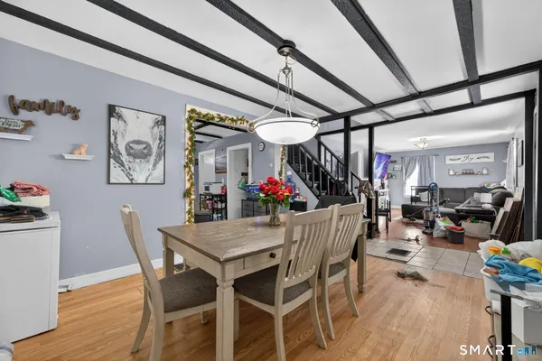 a white toilet sitting next to a bathroom sink and vanity
