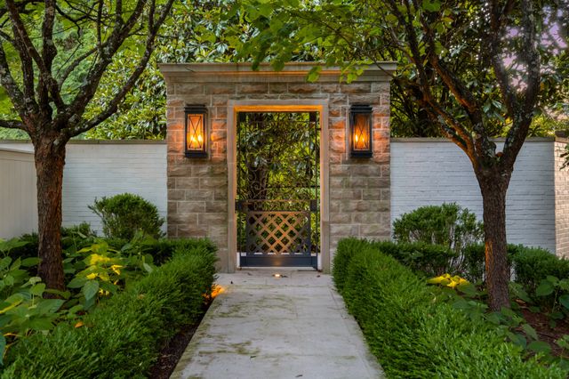 a view of backyard with swimming pool and outdoor seating
