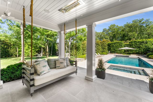a very nice looking living room with a large window
