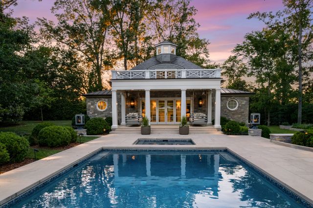 a spacious bedroom with a large bed and a large window