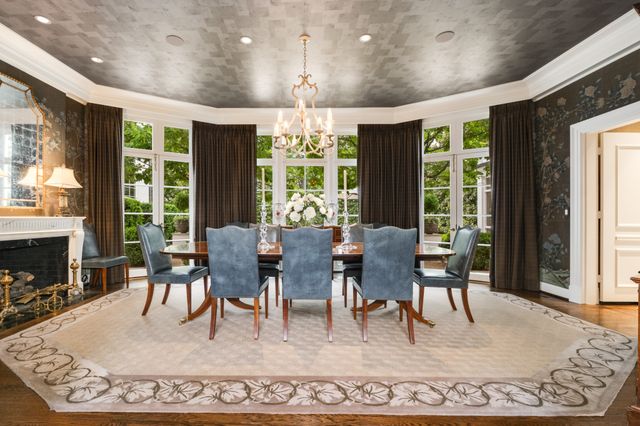 a bed room with a bed and a chandelier