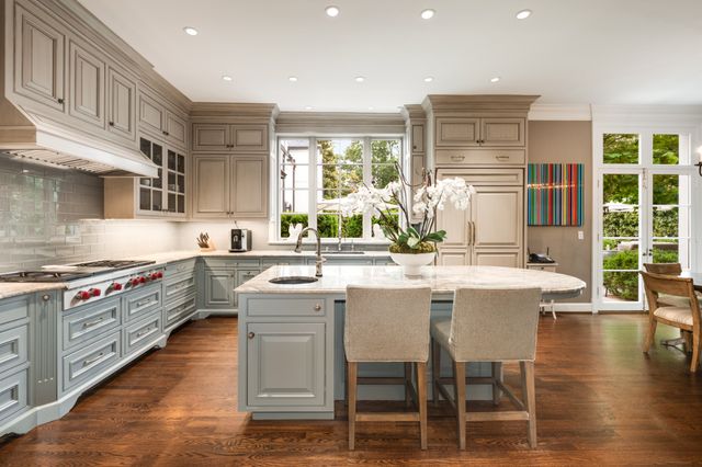 a view of a patio with table and chairs and potted plants