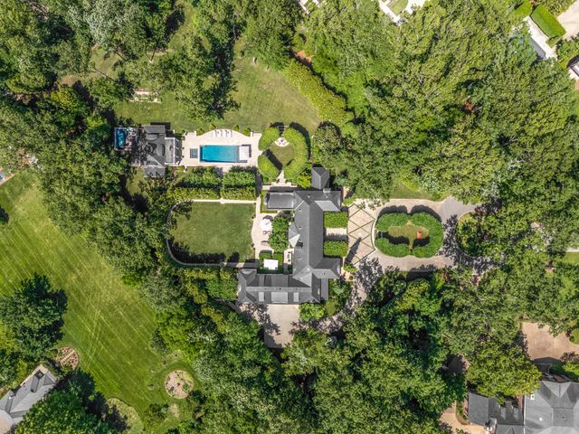 a view of a house with sitting area and potted plants