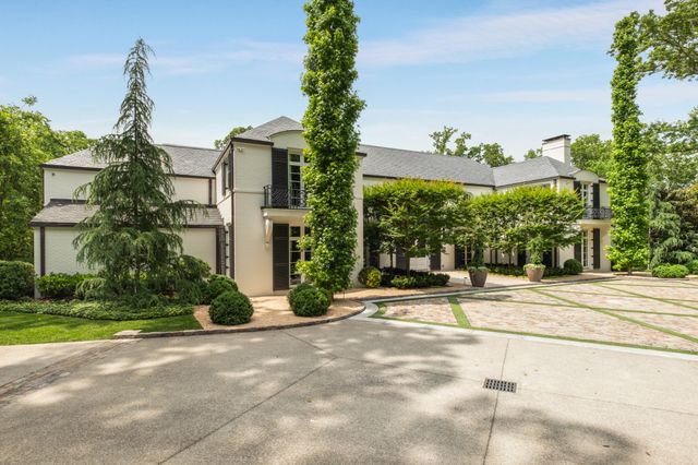 a view of swimming pool with lounge chairs and a yard