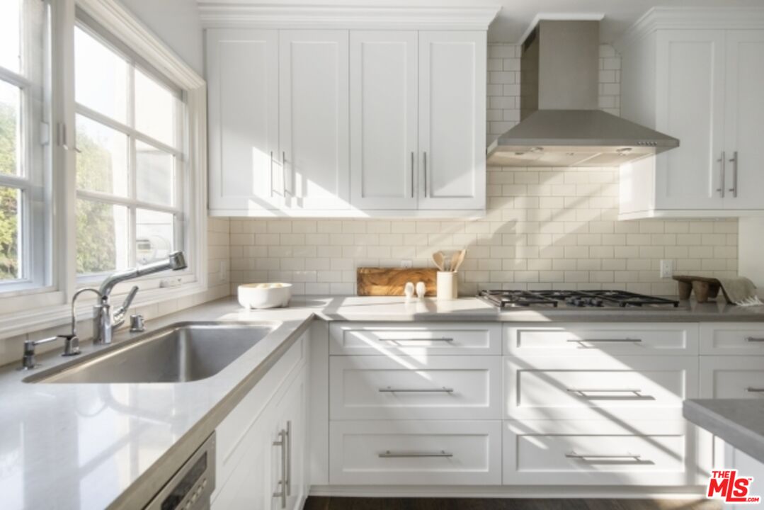 6607 Moore Drive Los Angeles, CA 90048 - Photo 14 of 42 a kitchen with a sink cabinets and window