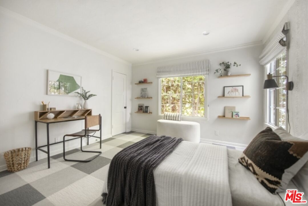 6607 Moore Drive Los Angeles, CA 90048 - Photo 27 of 42 a bedroom with a bed and a window