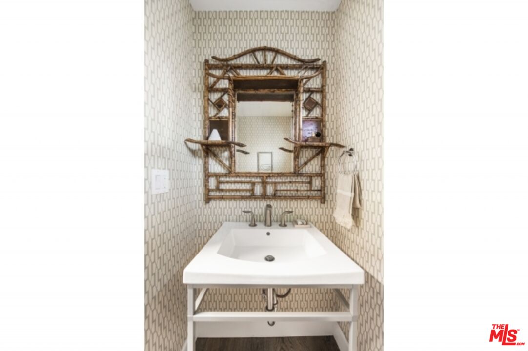 6607 Moore Drive Los Angeles, CA 90048 - Photo 28 of 42 a bathroom with a sink and a mirror