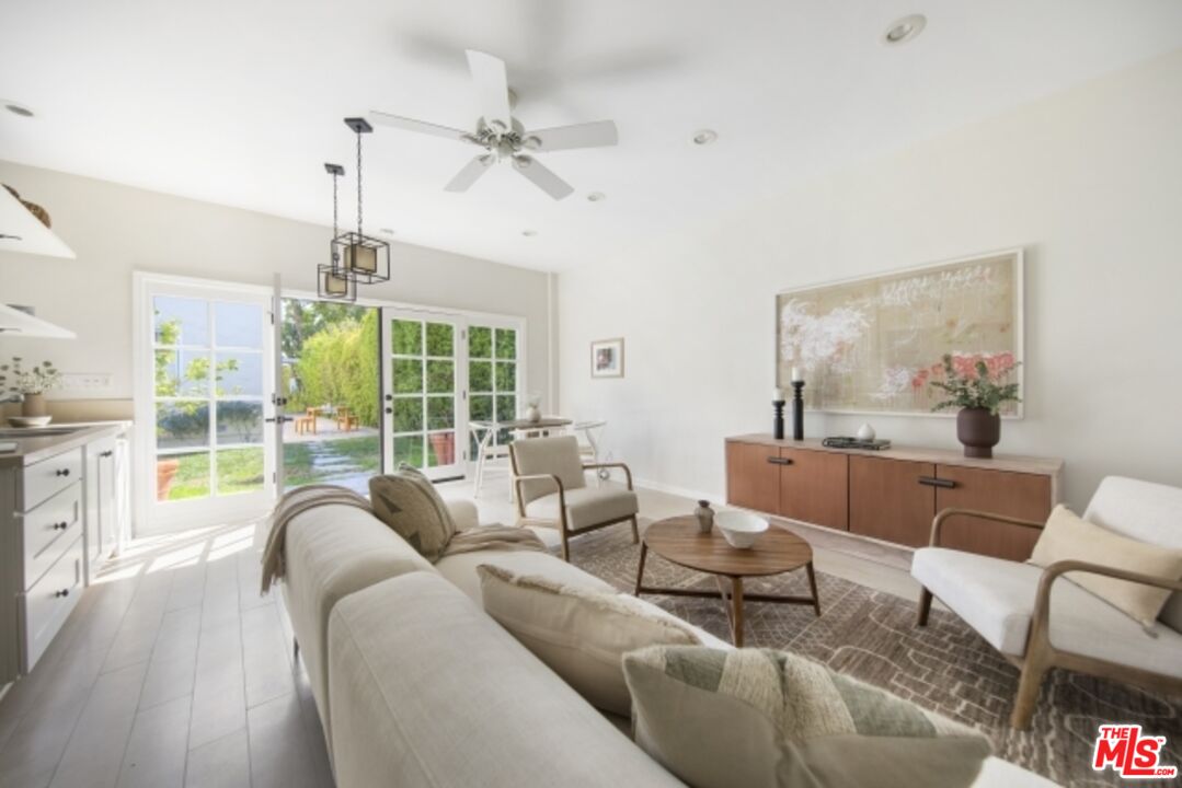 6607 Moore Drive Los Angeles, CA 90048 - Photo 32 of 42 a living room with furniture and a large window
