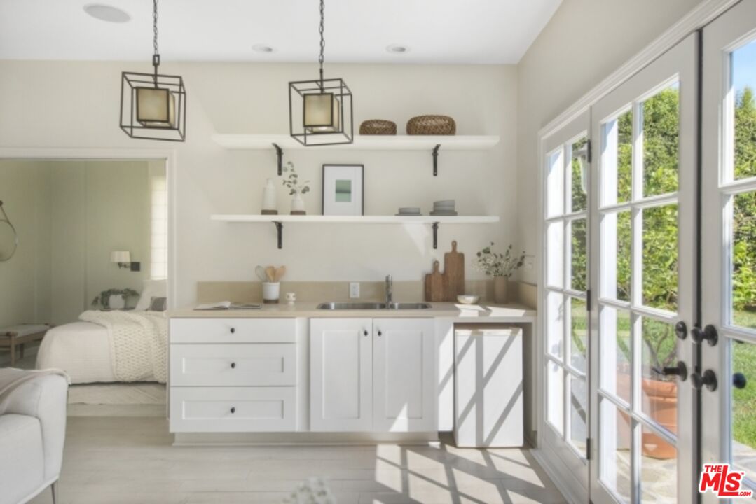 6607 Moore Drive Los Angeles, CA 90048 - Photo 33 of 42 a bathroom with a sink and a mirror