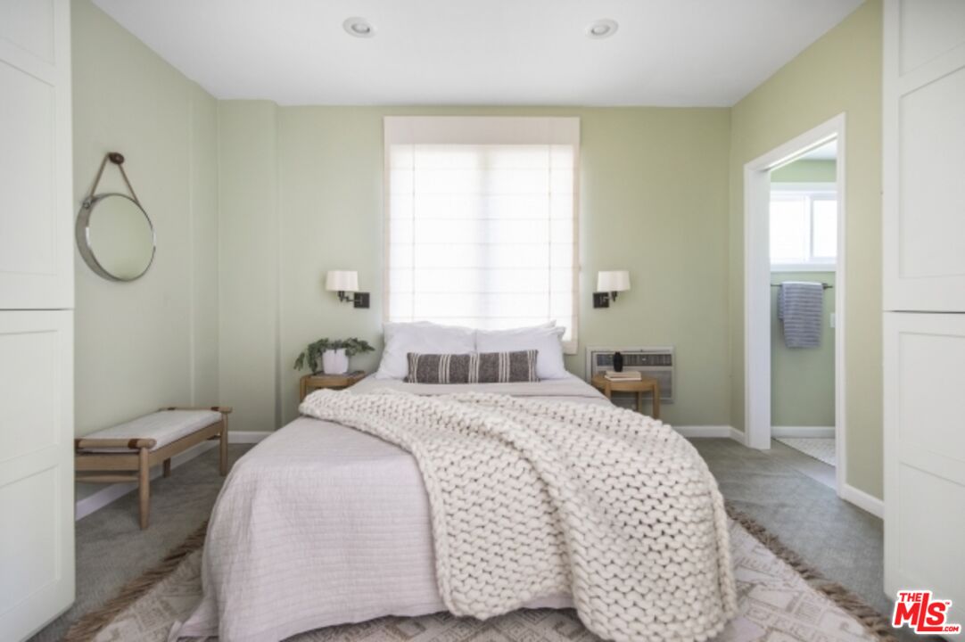 6607 Moore Drive Los Angeles, CA 90048 - Photo 34 of 42 a bedroom with a bed and window