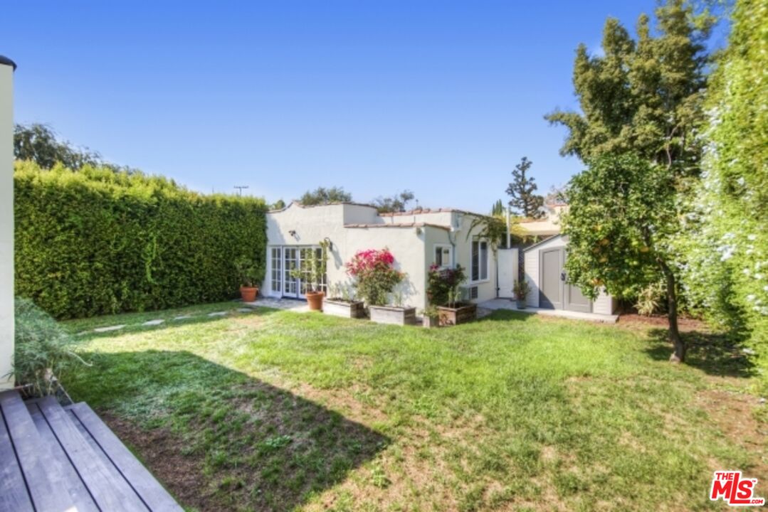 6607 Moore Drive Los Angeles, CA 90048 - Photo 37 of 42 a view of a house with yard and deck