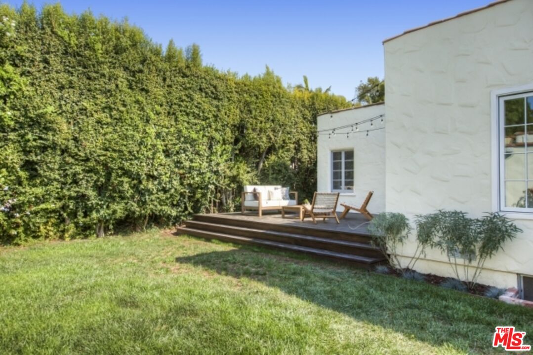 6607 Moore Drive Los Angeles, CA 90048 - Photo 39 of 42 a view of house with backyard and outdoor seating