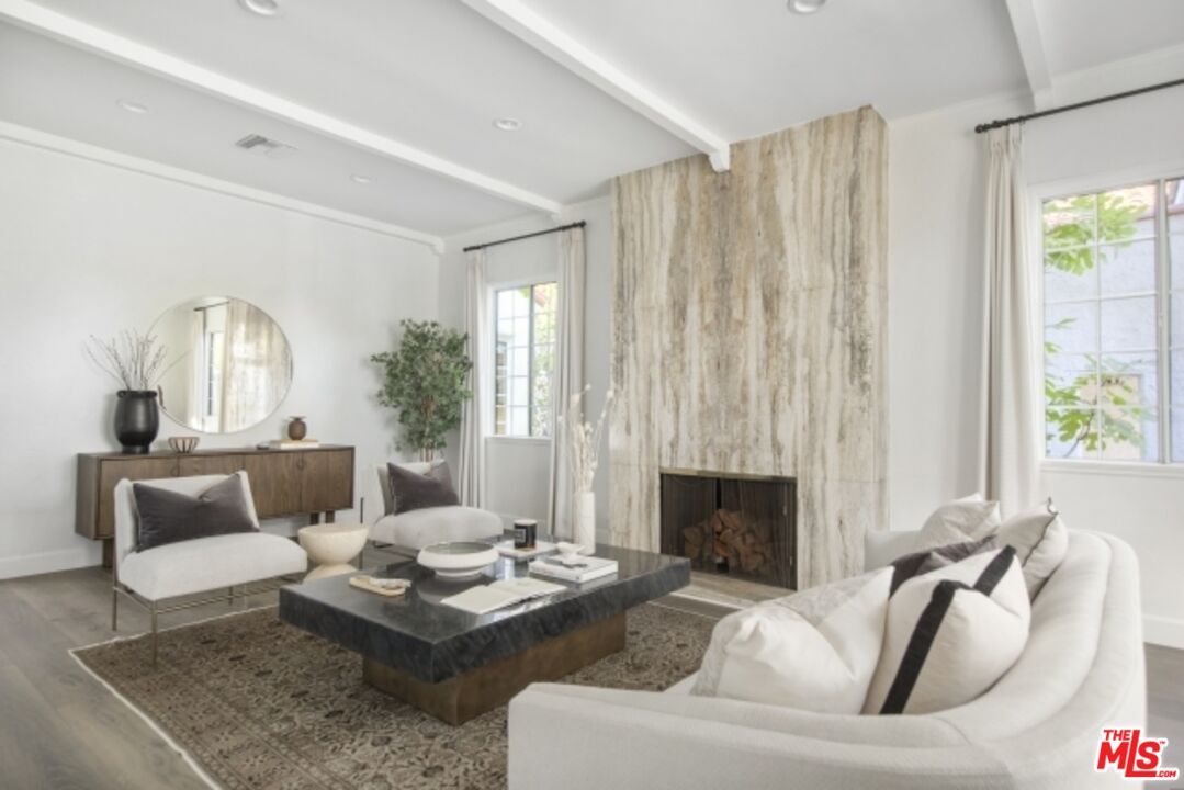 6607 Moore Drive Los Angeles, CA 90048 - Photo 4 of 42 a living room with furniture and a fireplace