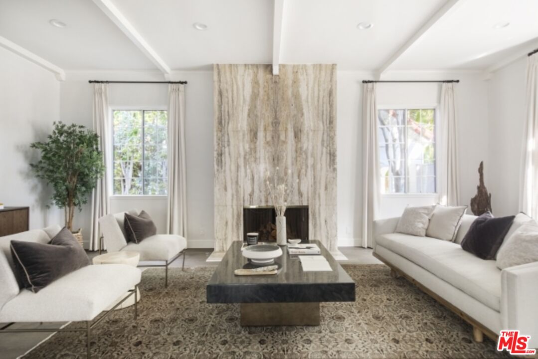 6607 Moore Drive Los Angeles, CA 90048 - Photo 5 of 42 a living room with furniture fireplace and a large window