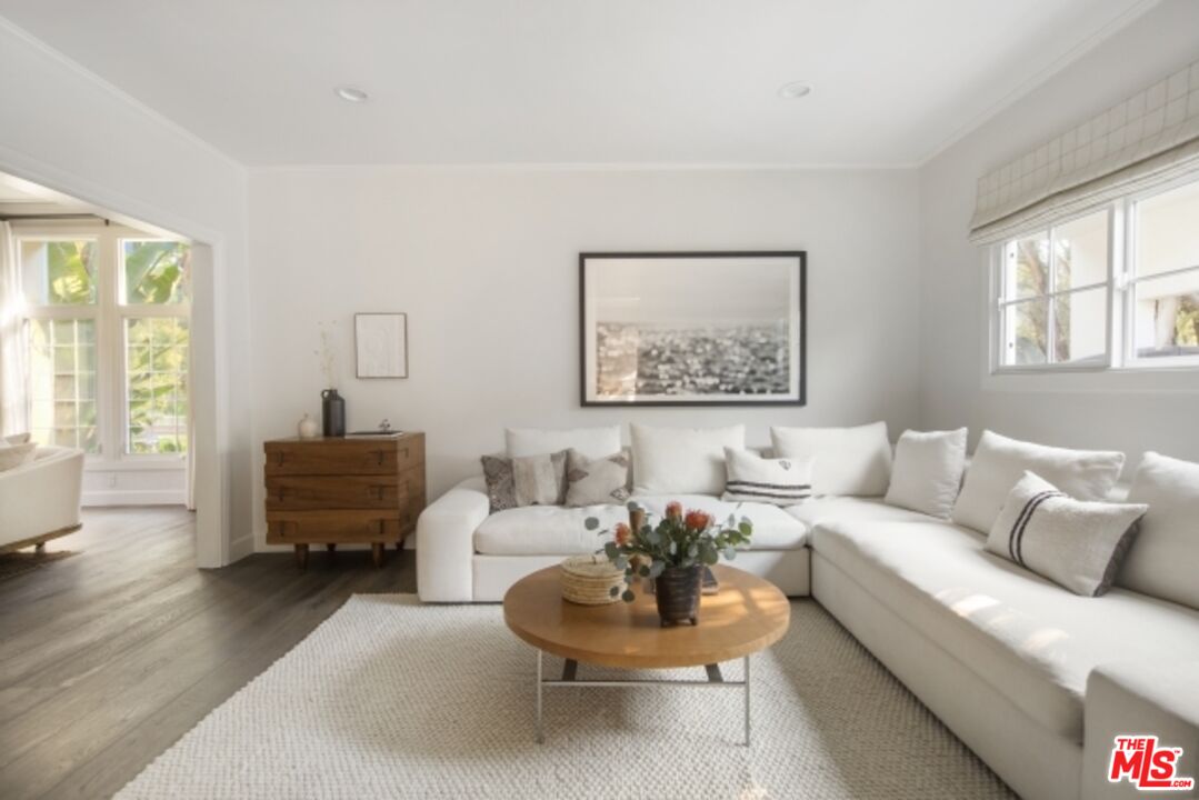6607 Moore Drive Los Angeles, CA 90048 - Photo 9 of 42 a living room with furniture and a large window